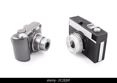 Out with the old, in with the new. Two cameras opposed to each other, old and new, isolated on white background. Stock Photo