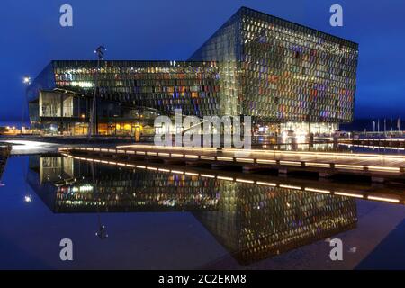 REYKJAVIK, ICELAND - AUGUST 9: Twilight scene of Harpa Concert Hall in Reykjavik harbor, Iceland late evening of August 9, 2013. The Harpa Concert Hal Stock Photo