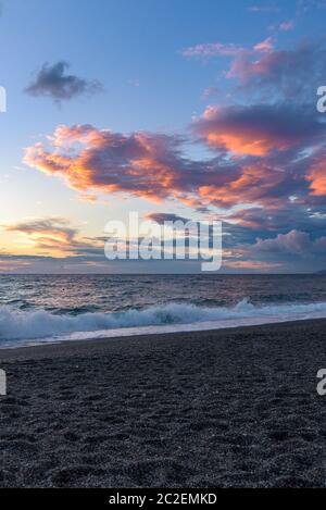 Picturesque sunset on the Calabrian beach in Italy Stock Photo