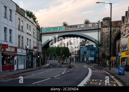 'The Arches', a cast iron Victorian viaduct, carries the Severn Beach Line suburban branch railway across Cheltenham Road, a main shopping street in N Stock Photo