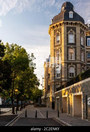 Evening light shines on the old Bristol General Hospital building, now an apartment complex, on Lower Guinea Street beside the Floating Harbour. Stock Photo