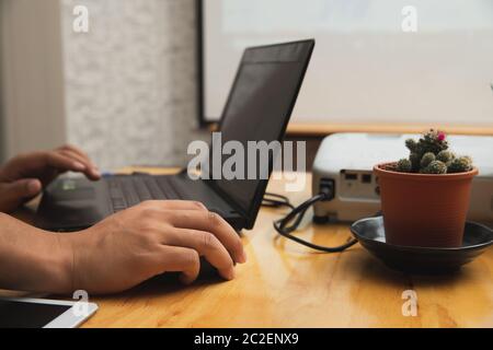Businessman working remotely from his home office. A man using laptop while online conference. Stock Photo