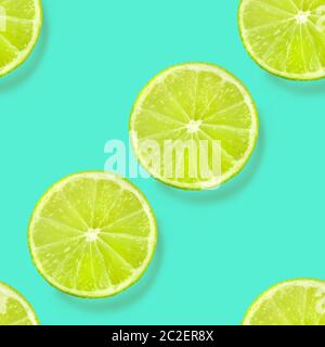 A seamless limes pattern on a vibrant teal blue background, a fruity citrus repeat print Stock Photo