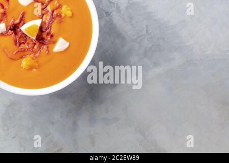 Salmorejo, Spanish cold tomato soup, close-up overhead shot with a place for text Stock Photo