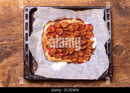 bavarian plum pie on dark wood Stock Photo