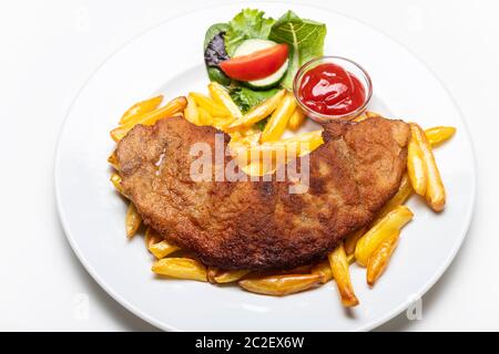 wiener schnitzel with french fries on a plate Stock Photo