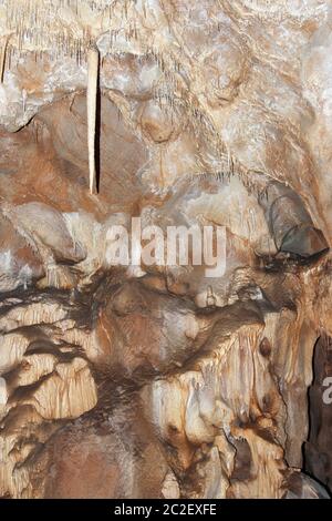 Stalactite cave - natural creation of the beautiful and bizarre stalactite formations Stock Photo