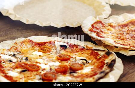 Freshly baked margherita pizza topped with tomato sauce, mozzarella and mushrooms. Stock Photo