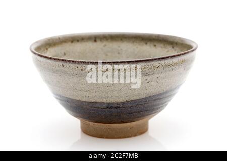 Single tea bowl used in Japanese matcha tea ceremony on white hackgrond Stock Photo