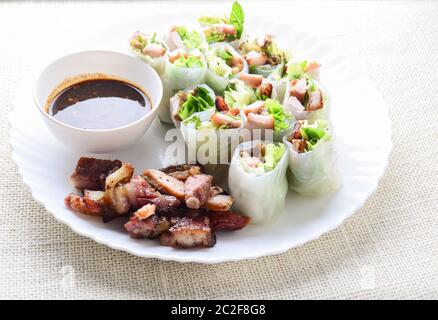 Fresh assorted Asian spring rolls with grilled pork, fresh vegetable. Healthy and delicious dish Stock Photo