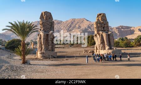 Luxor, Egypt - January 2020: The Colossi of Memnon, two stone massive statues of the Pharaoh Amenhotep III, who reigned in Egypt during the Dynasty XV