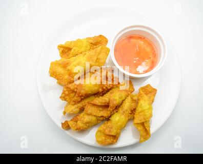 Deep Fried Won ton on white plate with dip source Stock Photo