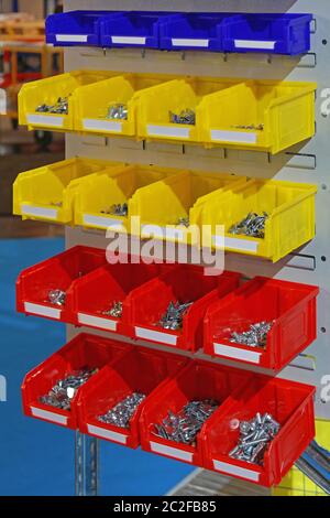 Colourful Plastic Sorting Bins With Bolts and Nuts Parts Stock Photo