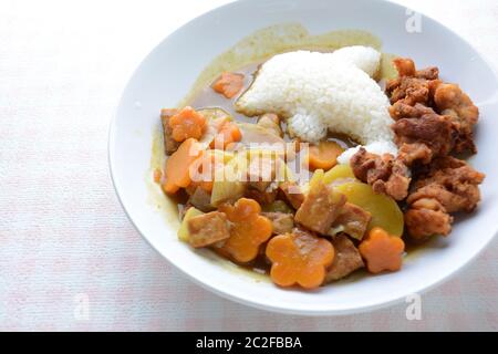 Japanese curry with dolphin rice shape and fried chicken. (Karaage) Stock Photo