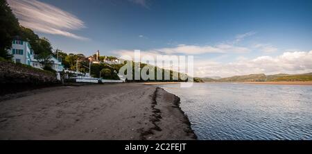 Portmeirion, Wales, UK - June 18, 2012: Evening sun shines on the estuary of the Afon Dwyryd River beside Portmeirion model village in North Wales. Stock Photo