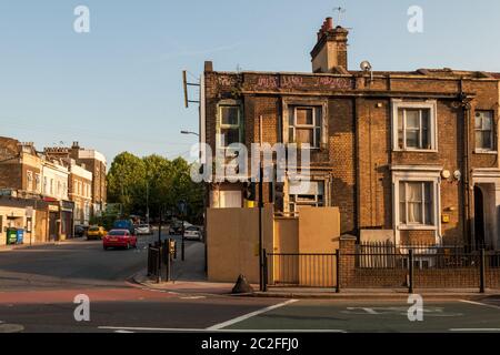 London, England, UK - June 28, 2010: A derelict house stands boarded up on the New Cross Road in South East London following the 'credit crisis' reces Stock Photo