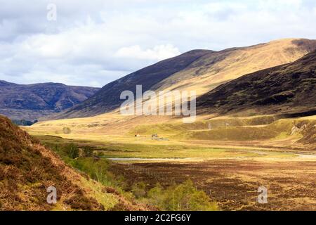 View down Glen Roy with two old buildings in the distant the Scottish highland Stock Photo