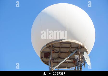 Meteorological radar station on the top of Sierra de Fuentes, Spain. Dome over blue sky Stock Photo