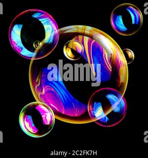 Bubble, Social Bubble, Bubbles floating on a isolated on a black background, studio photograph Stock Photo