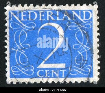 NETHERLANDS - CIRCA 1946: stamp printed by Netherlands, shows Numeral of Value, circa 1946 Stock Photo