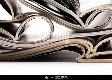 selective focus of the stacking magazine place on white background. Colorful abstract background Stock Photo