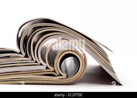 selective focus of the stacking magazine place on white background. Colorful abstract background Stock Photo