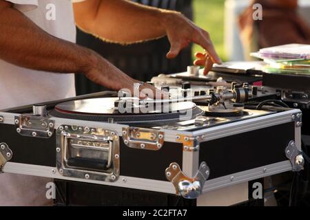 Turntable, hand of dj on the vinyl record Stock Photo