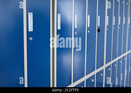 Close up of blue lockers in a row for individual storage use and privacy in changing rooms Stock Photo