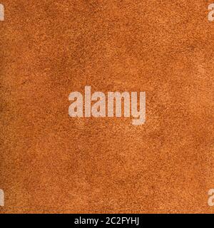 textured square background from dark orange suede close up Stock Photo