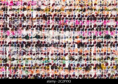 textile background - varicoloured woven yarns of boucle fabric close up Stock Photo