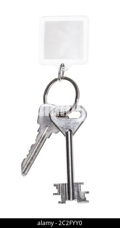 steel keys on keyring with blank keychain isolated on white background Stock Photo