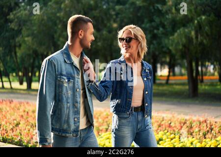Young couple in love walking outdoors Stock Photo