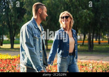 Young couple in love walking outdoors Stock Photo