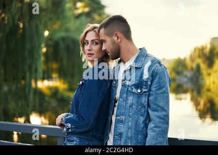 Young beautiful loving couple posing on nature Stock Photo