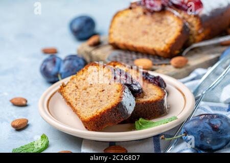 Slices of traditional plum cake on ceramic plate. Stock Photo