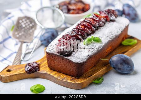 Cake with spiced plums. Stock Photo