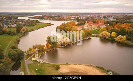 Autumn aerial view of Medieval castle in Nesvizh. Colorful maple park in Niasvizh ancient town. Minsk Region, Belarus Stock Photo