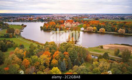 Autumn aerial view of Medieval castle in Nesvizh. Colorful maple park in Niasvizh ancient town. Minsk Region, Belarus Stock Photo