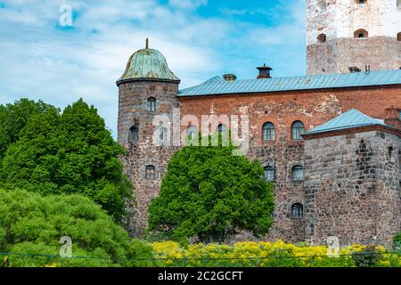 Architecture of old town Vyborg, Russia, Europe. Saint Olaf tower and Vyborg castle on summer day. Stock Photo