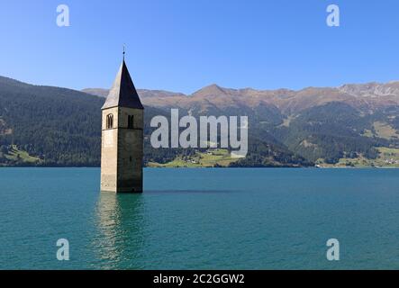 The sunken church tower in the Reschensee in Italy Stock Photo