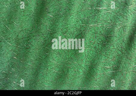 Green abstract plastic with fiberglass and dark spots in close-up Stock Photo