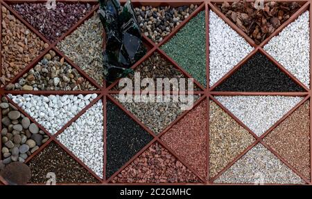 Multi-colored samples of marble, granite, and travertine chips and pebbles for landscape design Stock Photo