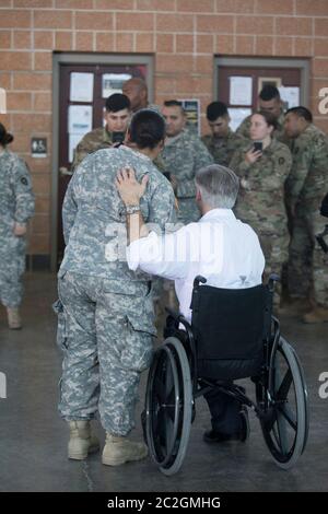 Weslaco, Texas USA, April 12, 2018: Texas Gov. Greg Abbott greets Army National Guard member at a National Guard armory in far south Texas where the troops are preparing for deployment at the Texas-Mexico border. The soldiers will be in a supporting role with federal Border Patrol and state troopers as they attempt to combat illegal immigration on the United States' southern border.  ©Bob Daemmrich Stock Photo