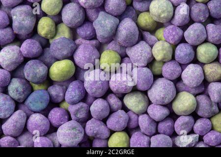 Purple mineral fertilizer, prolonged action with microelements, for application to the lawn in the spring. Professional fertilizer. Stock Photo