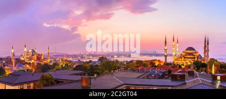 Sultan Ahmet Mosque and Hagia Sophia in the beautiful sunset panorama of Istanbul, Turkey. Stock Photo