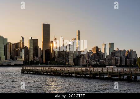 Long Island City Gantry sign and Manhattan midtwon skyline in front of east river Stock Photo