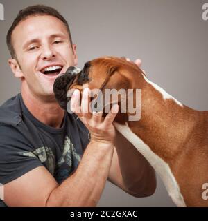 handsome laughing man with his dog Stock Photo