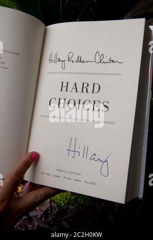 Austin, Texas USA, June 20, 2014: A fan shows off her autographed copy of Hillary Clinton's new memoir, 'Hard Choices,' during a book-signing event. The former First Lady, U.S. Senator and U.S. Secretary of State is on a nationwide book tour and is testing the waters for a presidential run in 2016.  ©Bob Daemmrich Stock Photo
