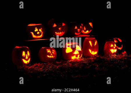 10 lit pumpkins at a Halloween display at the Brandywine Cemetary in Ann Arbor, Michigan Stock Photo