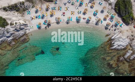 Mediterranean Greek landscape drone shot Kavourotripes beach. Sithonia Chalkidiki peninsula aerial top view with rocky coastal clear waters & sea beds Stock Photo